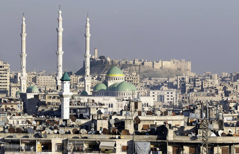 A general view taken on January 22, 2017, show the Aleppo Citadel (background-R) and the  President Mosque (L) a month after Syrian government forces retook the northern city from rebel fighters.  / AFP / LOUAI BESHARA